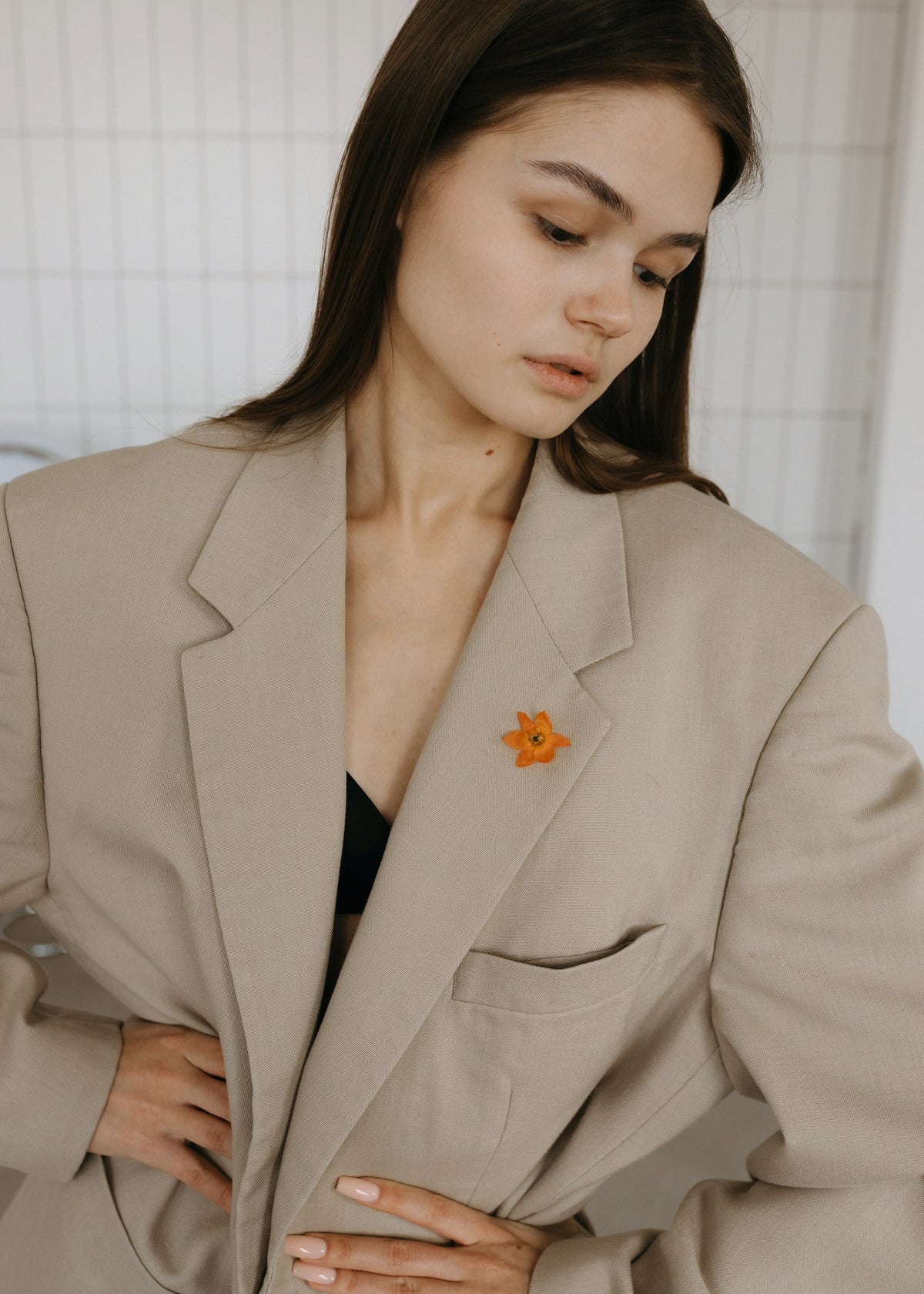 Woman in a tailored beige blazer